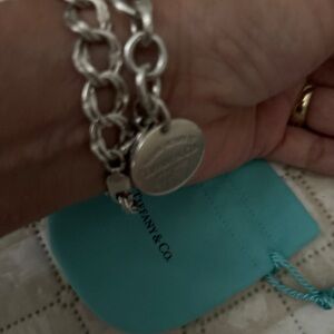 Tiffany & Co. round charm return to Tiffany blue trim w bracelet 2 charm only.L2